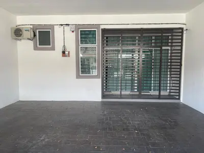 an empty room with a door and a window at Homestay Sakura in Padang Serai