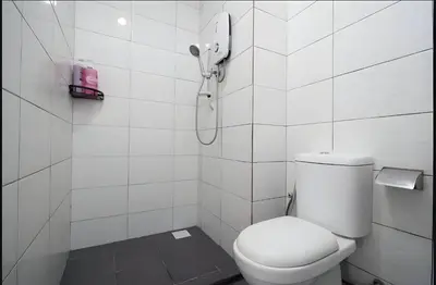 a white bathroom with a toilet and a shower at Serene Minimalist Family Retreat 2-7pax &Sunrise View in Brinchang