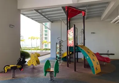 a play room with a slide and playground equipment at Straits Garden Suites Serenity Springs in Jelutong