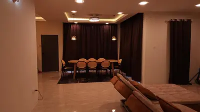 a dining room with a table and chairs at Sastred villa Mus'lim Only in Sungai Petani