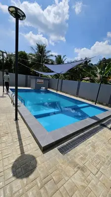 a large blue swimming pool on top of a building at Sastred villa Mus'lim Only in Sungai Petani