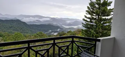 a balcony with a view of the mountains at FHCOMFYHOME B33A1 At SILVERPARK RESORT in Bukit Fraser