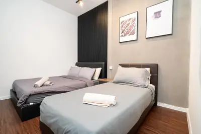 a room with two beds in a room with at Serene Industrial Family Retreat 2-7pax &Sunrise view in Brinchang