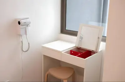 a room with a white desk with a phone and a stool at Serene Industrial Family Retreat 2-7pax &Sunrise view in Brinchang