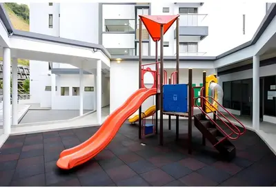 a playground in a building with a slide at Serene Industrial Family Retreat 2-7pax &Sunrise view in Brinchang