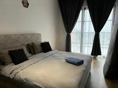 a bedroom with a large bed with a large window at Serene Terrace House 2-12pax &Sunrise View in Brinchang