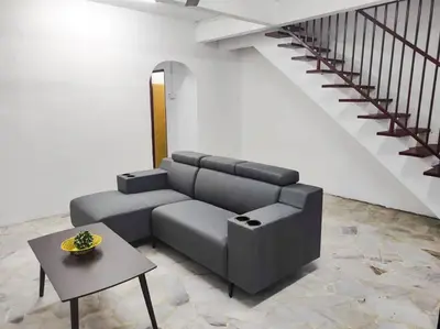 a living room with a couch and a table at SK Sweet Homestay SP Kedah in Sungai Petani