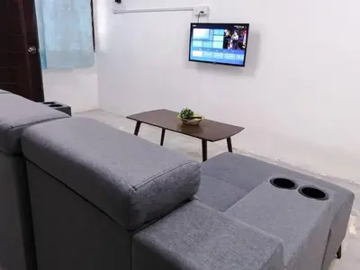 a living room with a couch and a table at SK Sweet Homestay SP Kedah in Sungai Petani