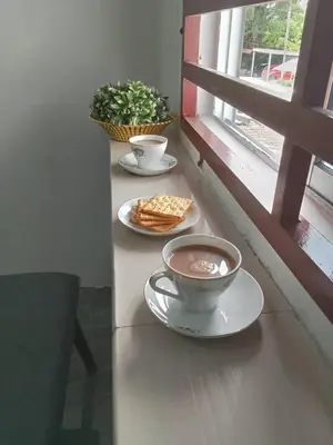 a table with two plates of food and a bowl of soup at SK Sweet Homestay SP Kedah in Sungai Petani