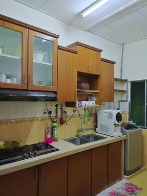 a kitchen with a sink and a microwave at Airis Homestay Bertam Perdana in Kepala Batas