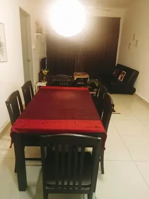 a dining room with a red table and chairs at Palas Horizon Cameron Highland in Brinchang