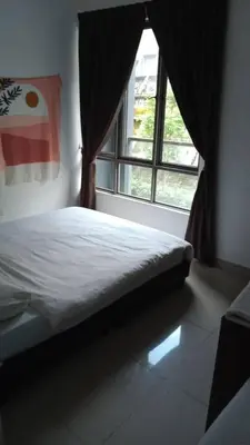 a bedroom with a bed in front of a window at Palas Horizon Cameron Highland in Brinchang