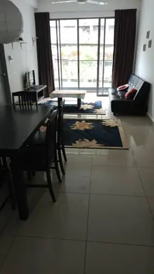 a living room with a table and chairs and a couch at Palas Horizon Cameron Highland in Brinchang
