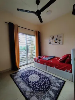 a bedroom with a bed and a ceiling fan at Homestay Tasnim Bertam 5 Rooms Corner lot in Kepala Batas