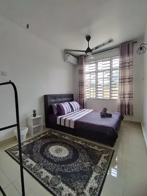a bedroom with a bed and a rug and a window at Homestay Tasnim Bertam 5 Rooms Corner lot in Kepala Batas