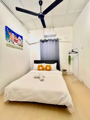 a bedroom with a large bed with two teddy bears on it at Cozy10perwira#6pax#Netflix#neariconcity&iconicpoint in Simpang Ampat