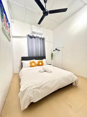 a bedroom with a bed with a teddy bear on it at Cozy10perwira#6pax#Netflix#neariconcity&iconicpoint in Simpang Ampat