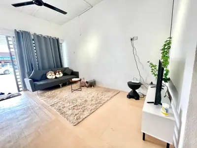a living room with a couch and a tv at Cozy10perwira#6pax#Netflix#neariconcity&iconicpoint in Simpang Ampat