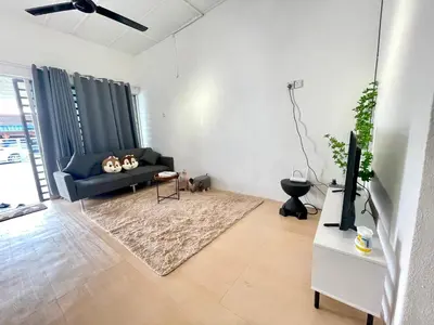 a living room with a couch and a tv at Cozy10perwira#6pax#Netflix#neariconcity&iconicpoint in Simpang Ampat