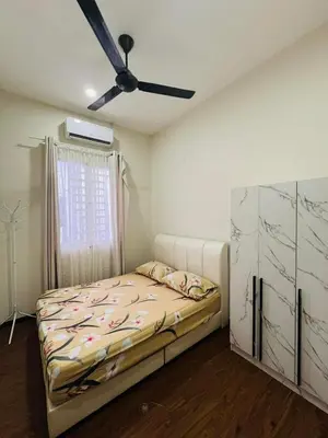a bedroom with a bed and a ceiling fan at Inap Kasih Homestay Gua Musang Bandar Utama - Free Wifi, Netflix, Coway Provided in Gua Musang
