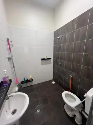 a bathroom with a toilet and a sink at Inap Kasih Homestay Gua Musang Bandar Utama - Free Wifi, Netflix, Coway Provided in Gua Musang