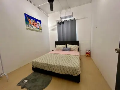 a bedroom with a bed and a rug at Home10perwira#6pax#netflix#simpangampat#neariconicpoint in Simpang Ampat