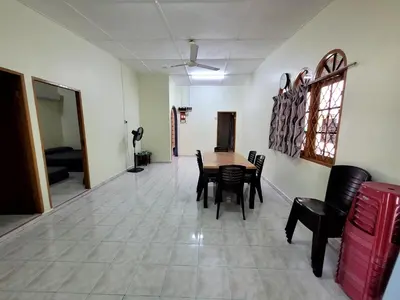 a dining room with a table and chairs at Pangkor Homestay in Pangkor