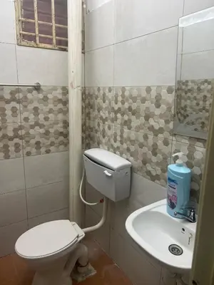 a bathroom with a toilet and a sink at Airis Homestay Bertam Perdana in Kepala Batas