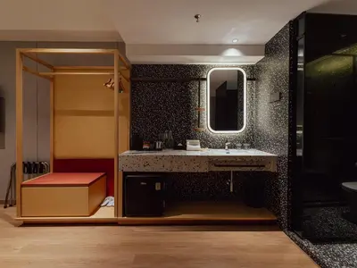 a bathroom with a sink and a mirror at Break & Stay formerly known as BreakX Hotel in George Town