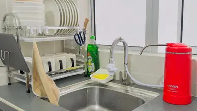 a kitchen counter with a sink and a sink at MujiStyle Brinchang Emerald Apartment Cameron 8guests 3bedrooms3bathroom in Brinchang