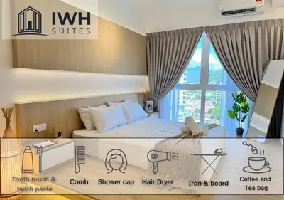 a bedroom with a bed and a window at ICC Ipoh Town Premium Suites By IWH Suites in Ipoh