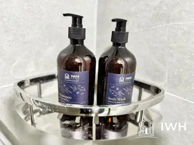 two bottles of wine sitting on a shelf in a sink at ICC Ipoh Town Premium Suites By IWH Suites in Ipoh