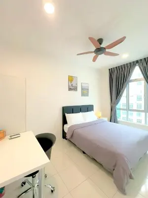 a bedroom with a bed and a ceiling fan at Anderson Ipoh Blissful Homestay in Ipoh