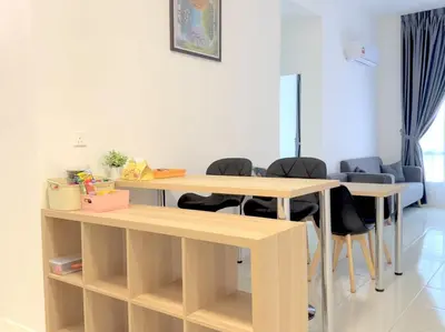 a room with two tables and chairs in it at Anderson Ipoh Blissful Homestay in Ipoh