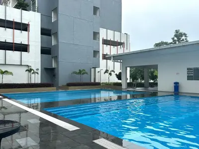 a large swimming pool in front of a building at Anderson Ipoh Blissful Homestay in Ipoh