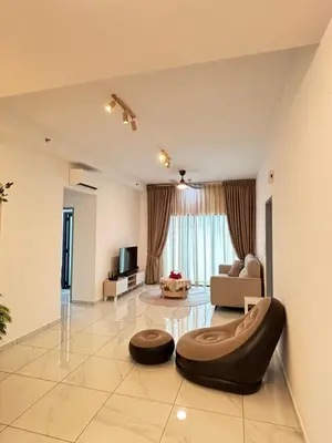 a living room with a couch and a chair at Cozy House in Batu Kawan