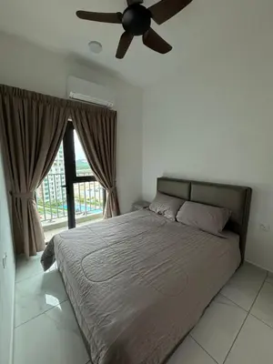 a bedroom with a bed with a ceiling fan at Cozy House in Batu Kawan