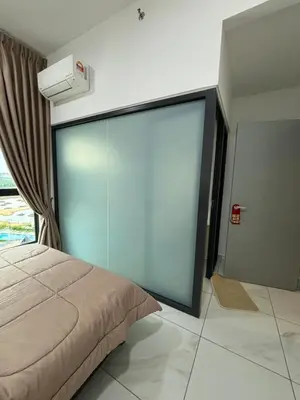 a bedroom with a large glass wall at Cozy House in Batu Kawan