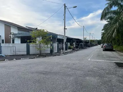 an empty street with cars parked on the side of the road at yasmins homestay in Sitiawan