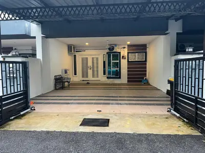 an empty entrance to a house with a gate at yasmins homestay in Sitiawan