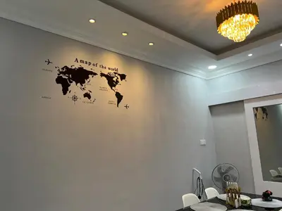 a map of the world on a white wall at yasmins homestay in Sitiawan