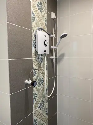 a shower with a shower head in a bathroom at EG Home at The Anderson in Ipoh