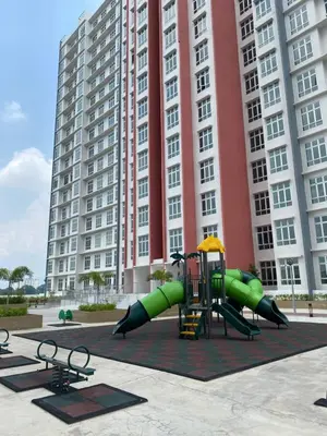 a playground in front of a large building at EG Home at The Anderson in Ipoh