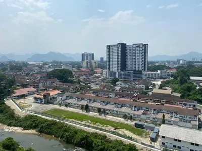 an aerial view of a city with a river and buildings at EG Home at The Anderson in Ipoh