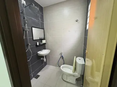 a bathroom with a toilet and a sink at \u4e07\u91cc\u671b Menglembu Bestari Homestay in Menglembu