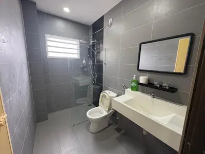 a bathroom with a white toilet and a sink at \u4e07\u91cc\u671b Menglembu Bestari Homestay in Menglembu