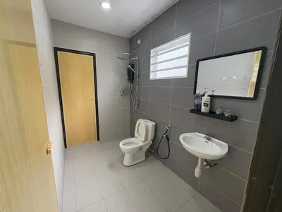 a bathroom with a toilet and a sink at \u4e07\u91cc\u671b Menglembu Bestari Homestay in Menglembu