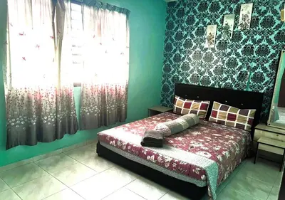 a bedroom with a bed and a window at COZY Home Terrace - 1km to Water Theme Park Tambun Ipoh in Ipoh