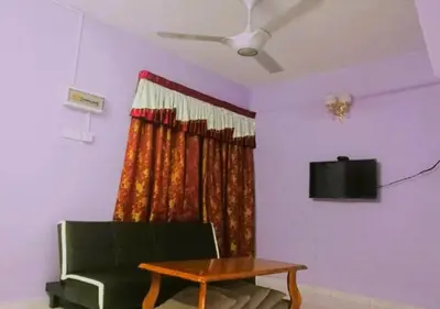 a living room with a couch and a table at COZY Home Terrace - 1km to Water Theme Park Tambun Ipoh in Ipoh