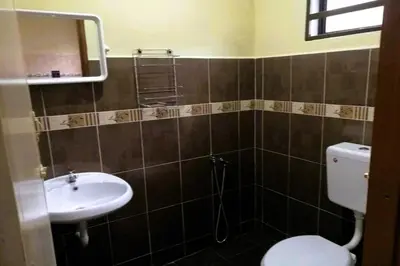 a bathroom with a toilet and a sink at COZY Home Terrace - 1km to Water Theme Park Tambun Ipoh in Ipoh